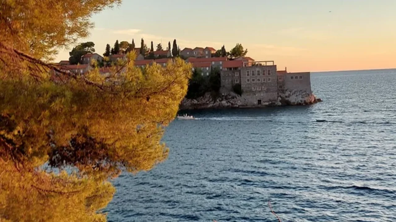 The Budva Riviera coast, with Sveti Stefan islet and calm Adriatic water below wooded hills