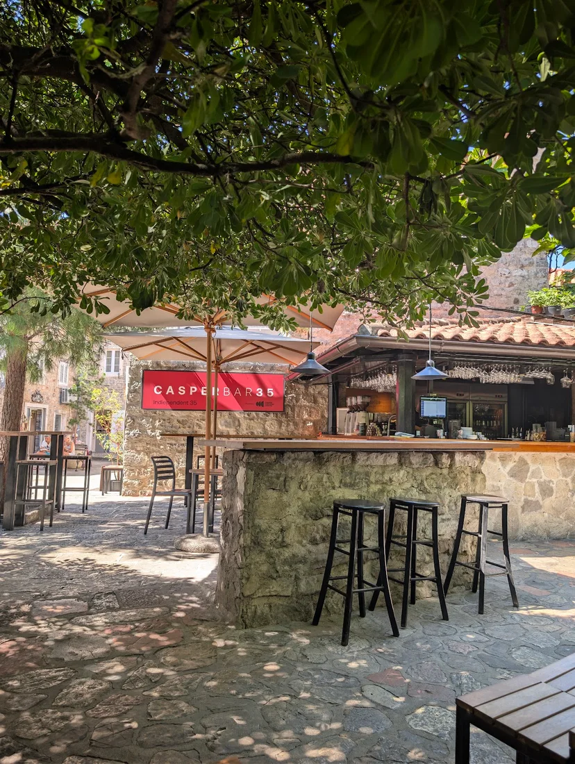 The stone bar counter and courtyard of Casper Bar in Budva Old Town, Montenegro