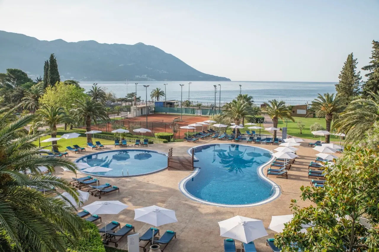 Resort pools overlooking the Adriatic and mountains at Iberostar Waves Bellevue in Bečići