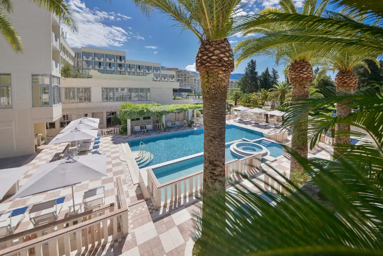 Outdoor pool and checkerboard sun terrace at the Mediteran resort in Bečići
