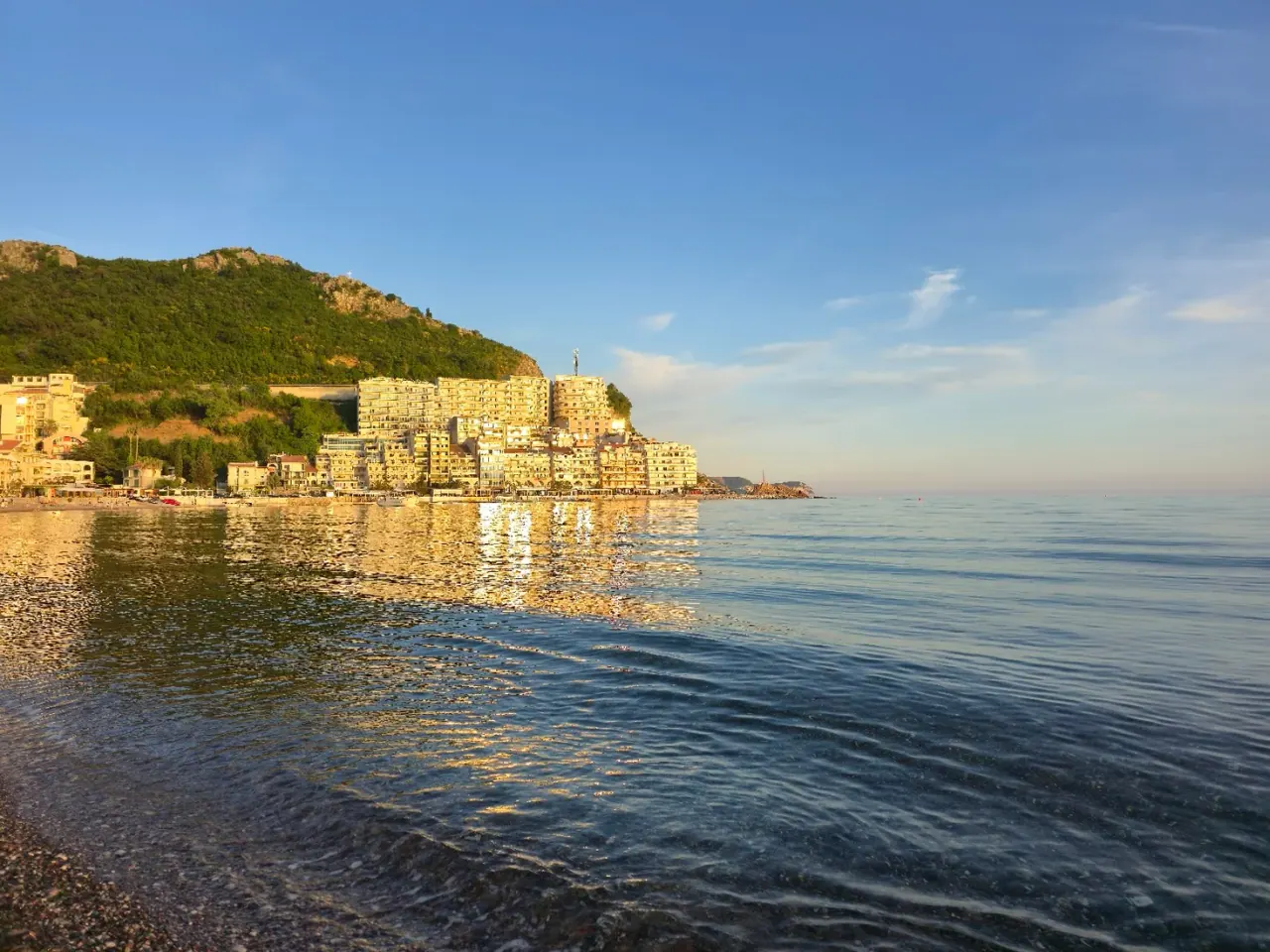 The village of Rafailovići on its point at golden hour, at the south end of Bečići beach