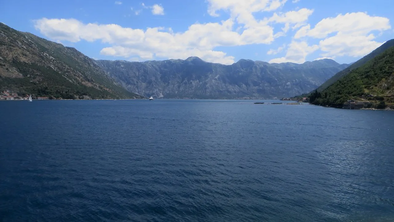 The fjord-like Bay of Kotor ringed by steep green mountains, Montenegro