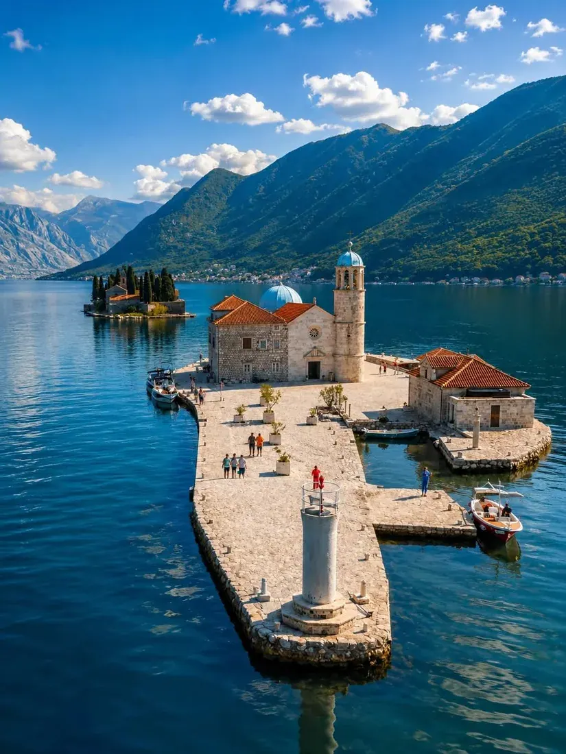 Aerial view of Our Lady of the Rocks islet church and its causeway in the Bay of Kotor